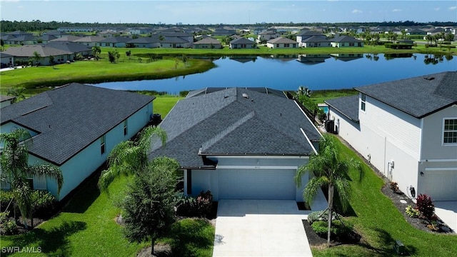 bird's eye view featuring a residential view and a water view