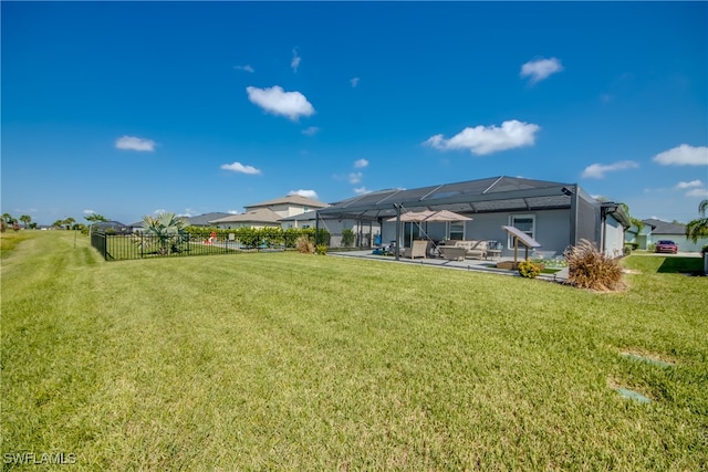 view of yard with a lanai and a patio