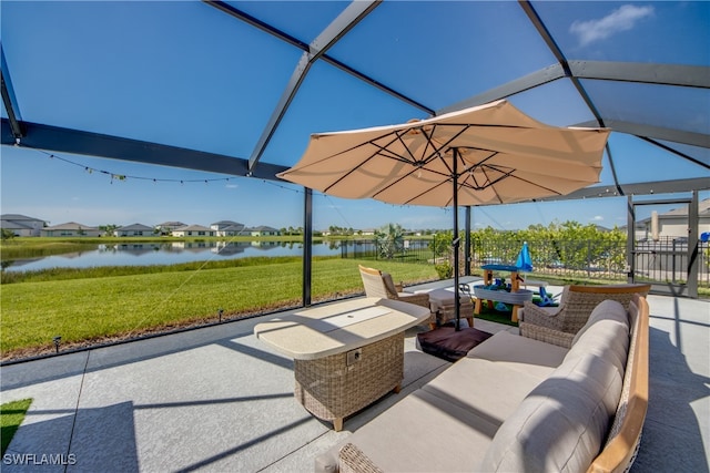 view of patio with an outdoor living space and a water view