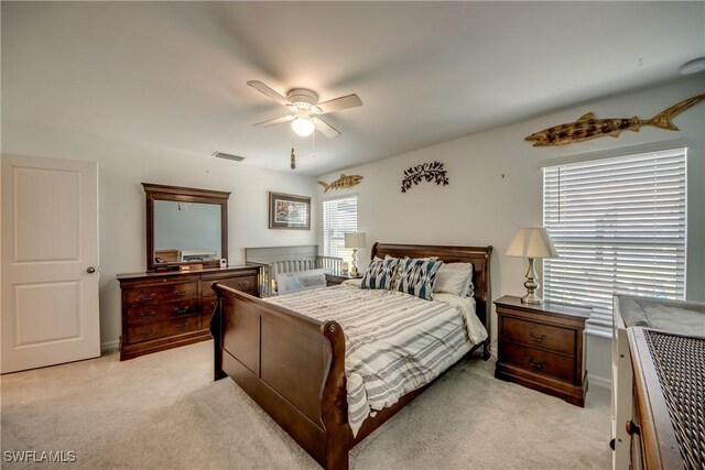 carpeted bedroom featuring ceiling fan