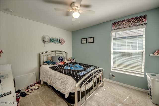 carpeted bedroom featuring ceiling fan