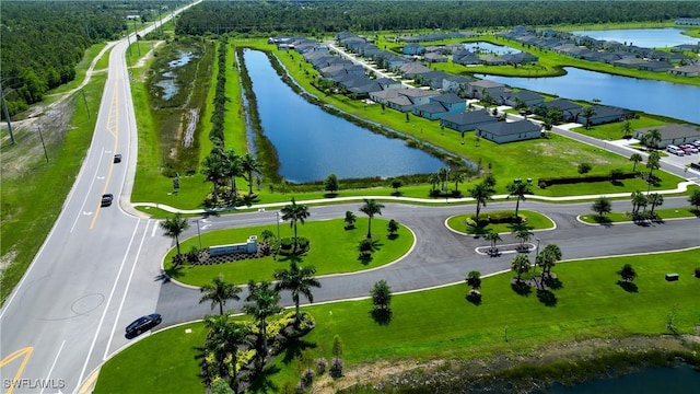 aerial view featuring a water view and a residential view