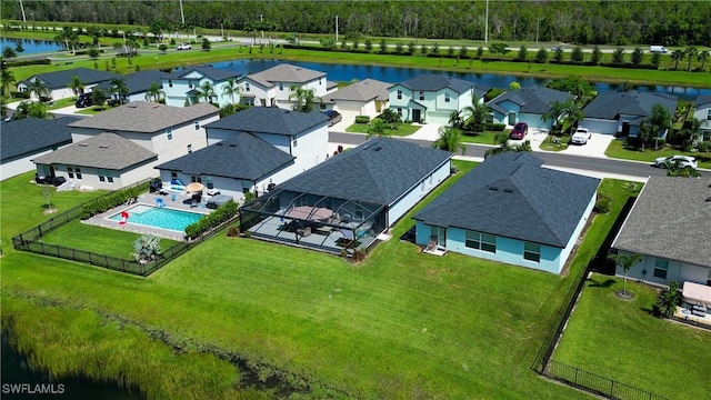 birds eye view of property featuring a residential view and a water view