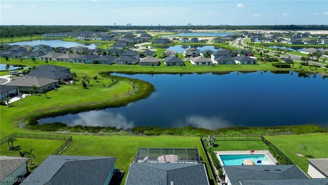 birds eye view of property featuring a water view