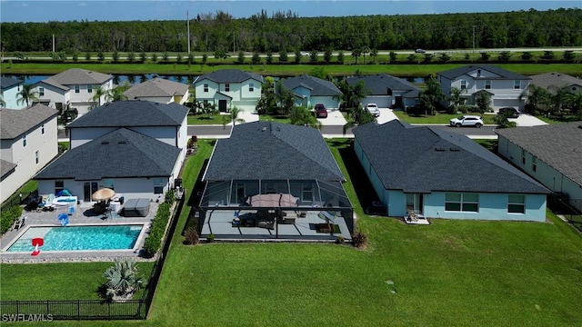 birds eye view of property with a residential view and a view of trees