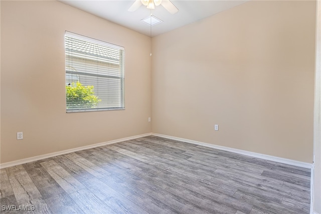 empty room featuring ceiling fan and wood-type flooring