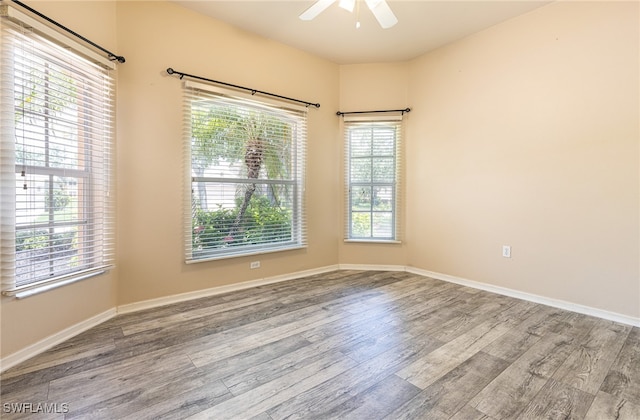 unfurnished room featuring ceiling fan and wood-type flooring