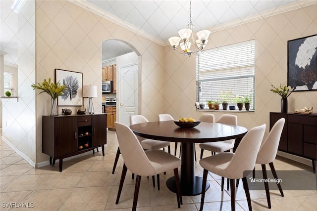 dining space with a notable chandelier, light tile patterned flooring, and crown molding