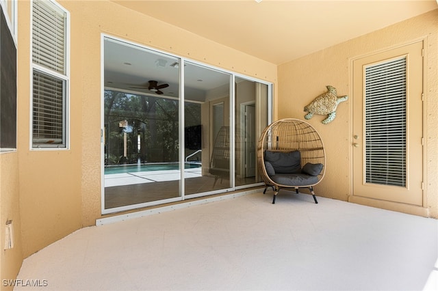 view of patio featuring ceiling fan