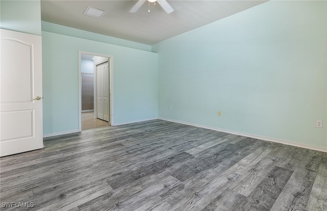 spare room featuring hardwood / wood-style floors and ceiling fan