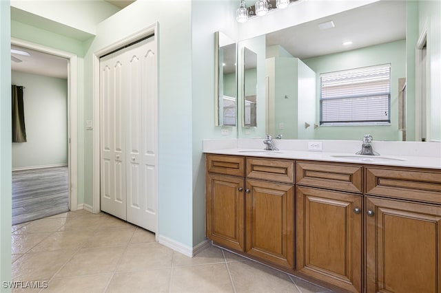 bathroom featuring double sink vanity and tile patterned flooring