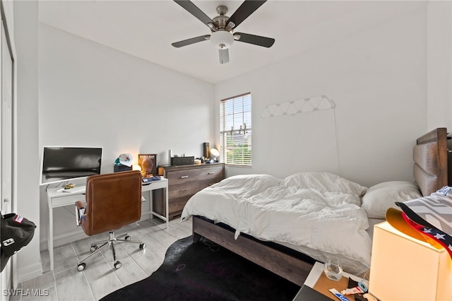 bedroom featuring ceiling fan and light hardwood / wood-style flooring