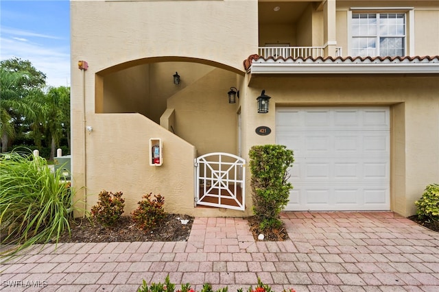 entrance to property with a balcony