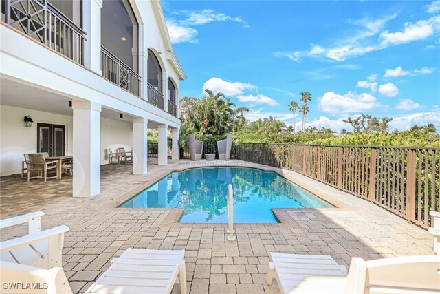 view of pool featuring a patio