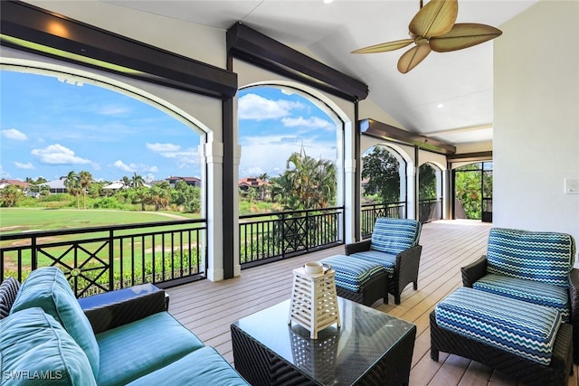 wooden terrace with vaulted ceiling and ceiling fan