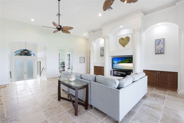 living room with ceiling fan and french doors