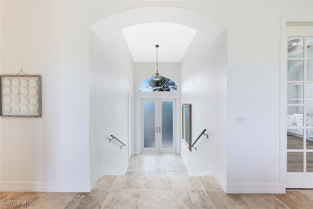 entrance foyer with french doors and light tile patterned flooring