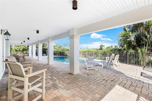 view of patio featuring a fenced in pool