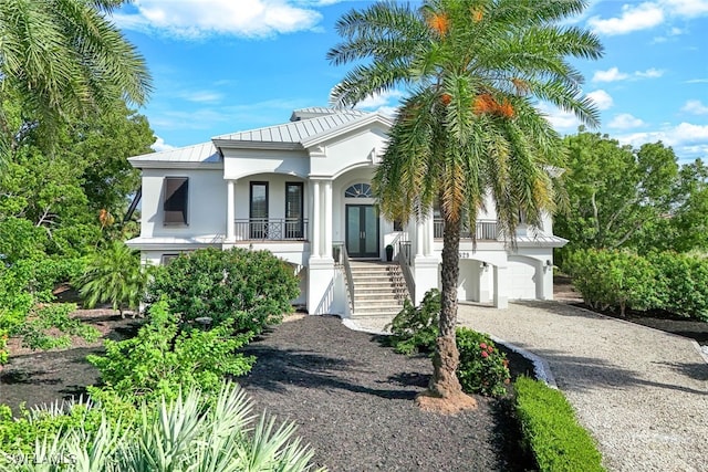 view of front of house with french doors and a garage