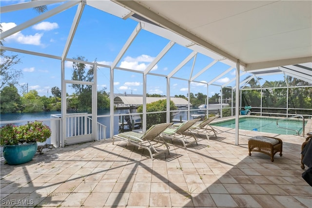 exterior space featuring a lanai and a water view