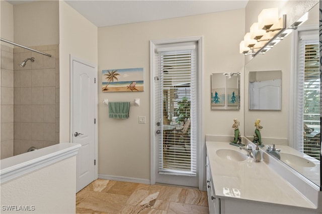 bathroom featuring vanity and a tile shower