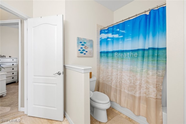 bathroom with tile patterned floors, toilet, and shower / tub combo with curtain