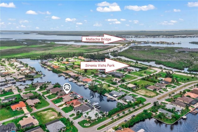 aerial view with a residential view and a water view