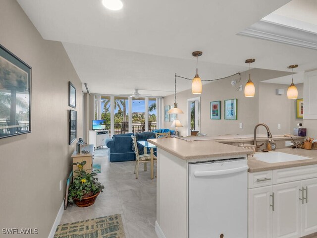 kitchen with pendant lighting, white cabinetry, sink, ceiling fan, and white dishwasher