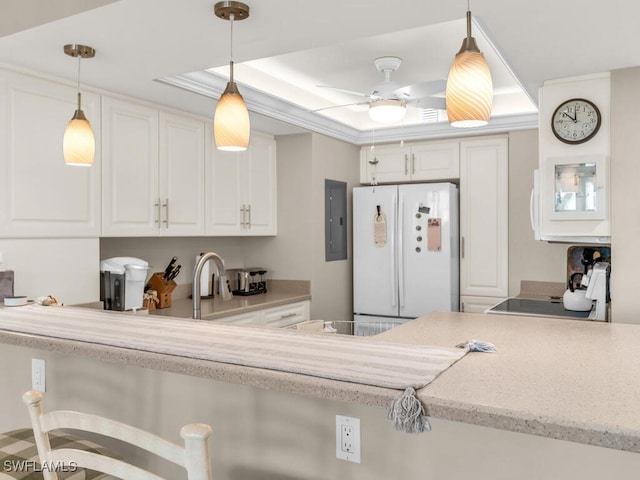 kitchen with range, electric panel, white cabinets, a raised ceiling, and white fridge