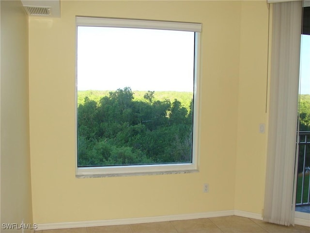 1001 Arbor Lake Dr Unit 203, Naples, FL 34110 - tiled spare room with visible vents and baseboards