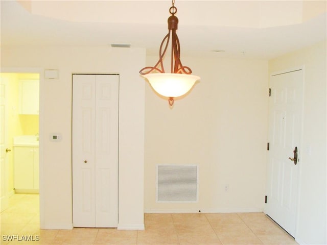 1001 Arbor Lake Dr Unit 203, Naples, FL 34110 - unfurnished dining area featuring light tile patterned flooring, visible vents, and baseboards