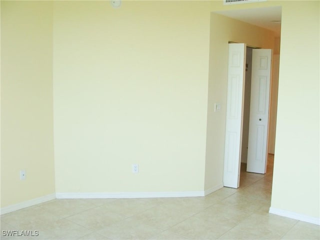 1001 Arbor Lake Dr Unit 203, Naples, FL 34110 - unfurnished room featuring visible vents, baseboards, and light tile patterned flooring