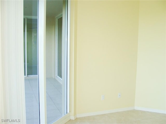 1001 Arbor Lake Dr Unit 203, Naples, FL 34110 - interior space with baseboards and light tile patterned flooring