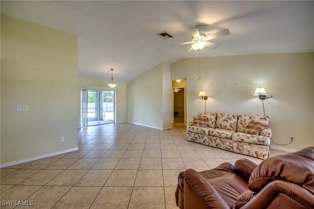 living room with ceiling fan, light tile patterned floors, and lofted ceiling