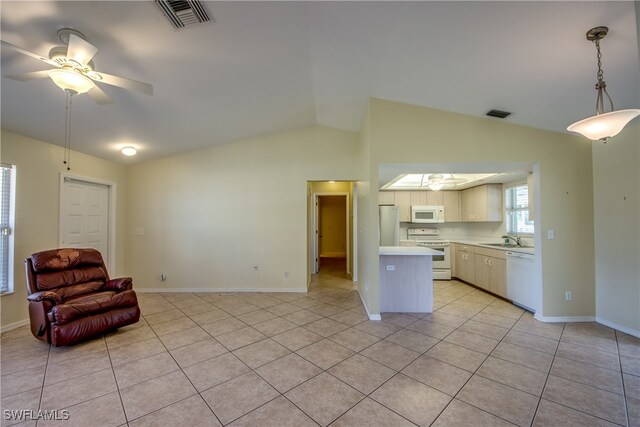 interior space featuring white appliances, light tile patterned floors, lofted ceiling, hanging light fixtures, and ceiling fan