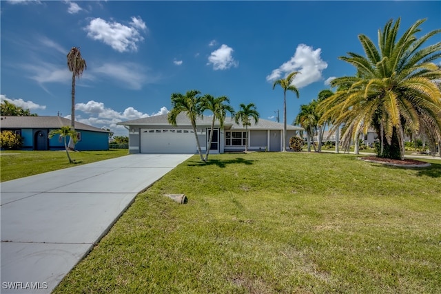 view of front of property with a front yard and a garage