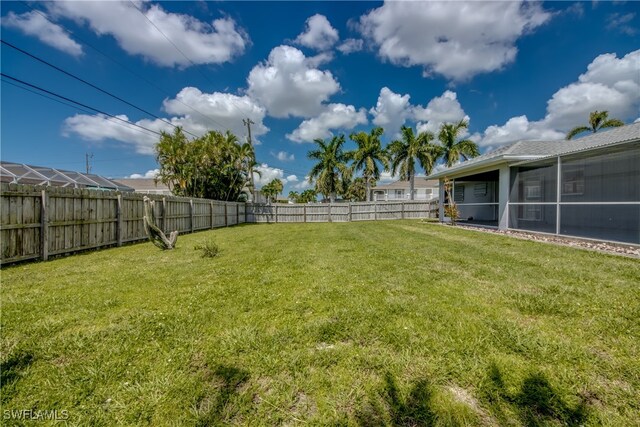 view of yard with a sunroom