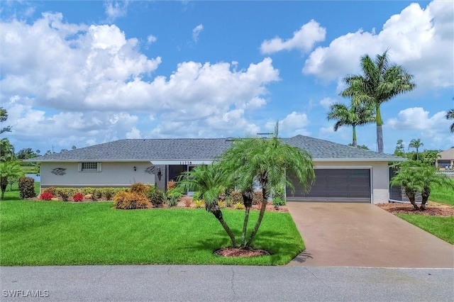 ranch-style house featuring a garage and a front yard