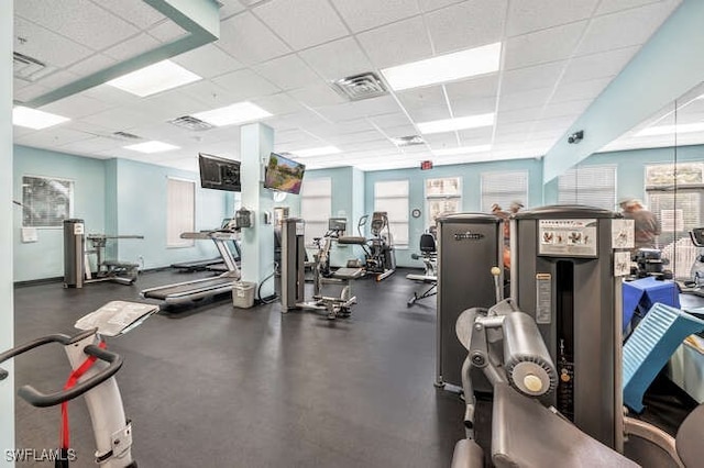 workout area with a paneled ceiling