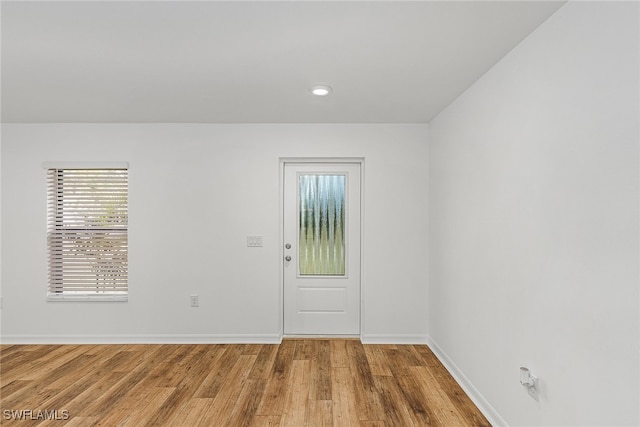 empty room with hardwood / wood-style floors