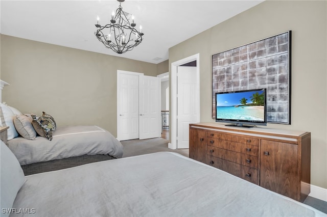 carpeted bedroom with a chandelier