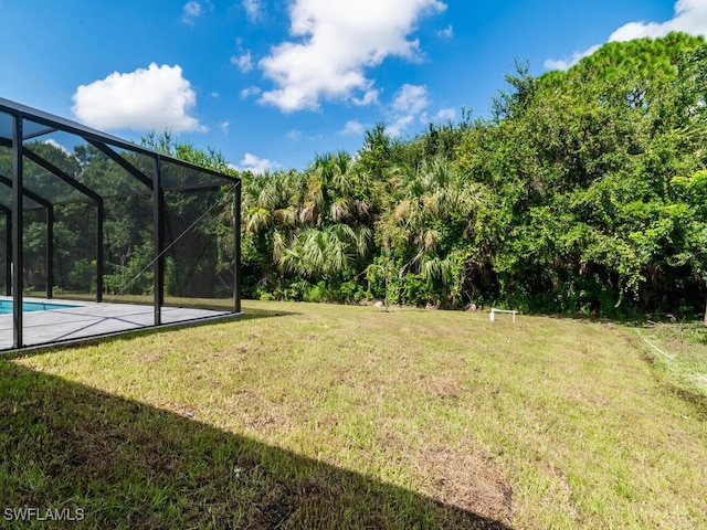 view of yard featuring a lanai