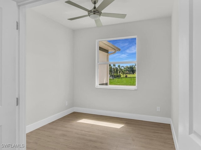 spare room featuring light wood-type flooring and ceiling fan