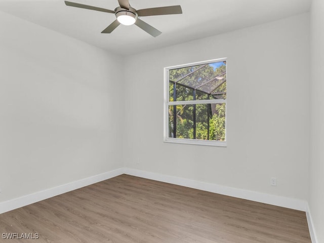 empty room featuring ceiling fan and hardwood / wood-style flooring