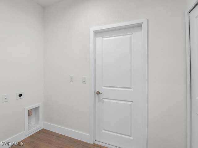 washroom featuring hardwood / wood-style floors and electric dryer hookup