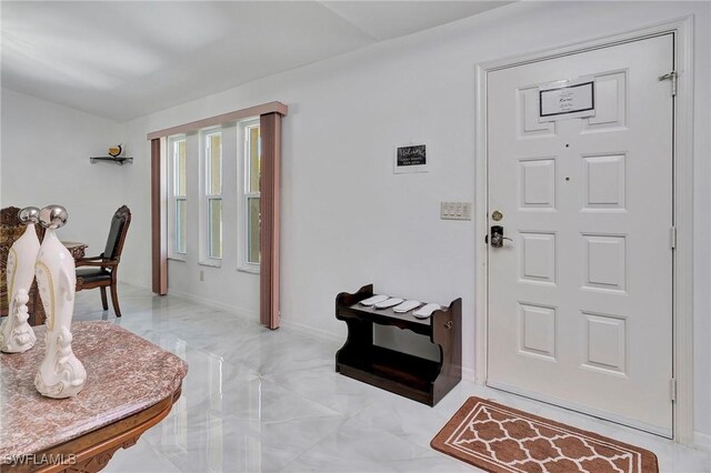 entryway featuring light tile patterned floors