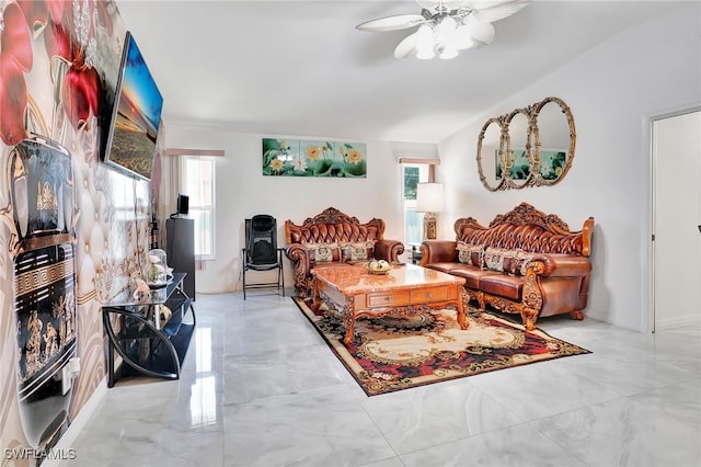 living room featuring ceiling fan and light tile patterned flooring