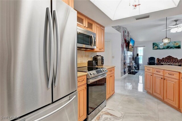 kitchen featuring tasteful backsplash, light tile patterned flooring, stainless steel appliances, and ceiling fan