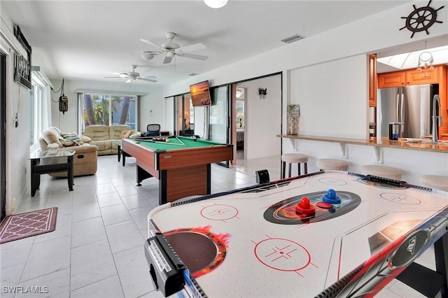 playroom with light tile patterned flooring, pool table, and ceiling fan