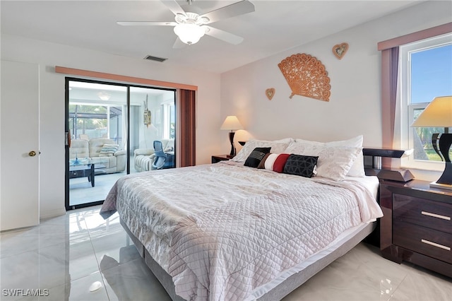 tiled bedroom with ceiling fan, access to outside, and multiple windows